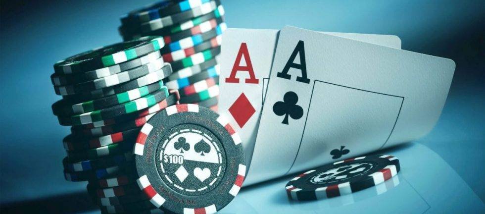 Poker chips and playing cards, including two aces.