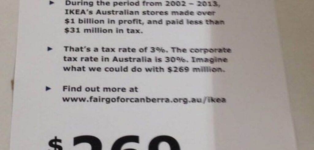 Protest sign highlighting IKEA's low tax rate in Australia (2002-2013): $269 million tax shortfall. #MidnightOil