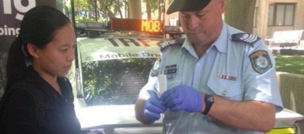 Police officer administering a roadside drug test