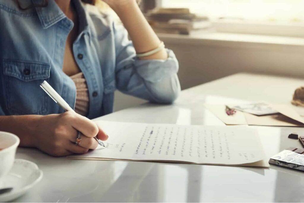 Woman writing sincere apology letter for drink driving offence.
