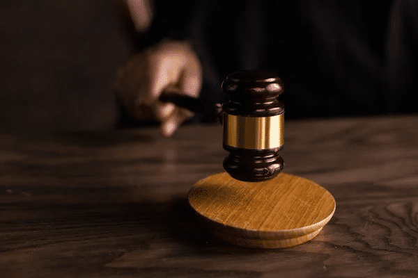 Judge's gavel on a desk, representing legal proceedings for an apprehended violence order (AVO) concept.