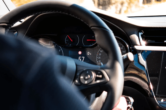 Close-up of a car dashboard and steering wheel, related to drug driving offence penalties and detection in NSW, Australia.