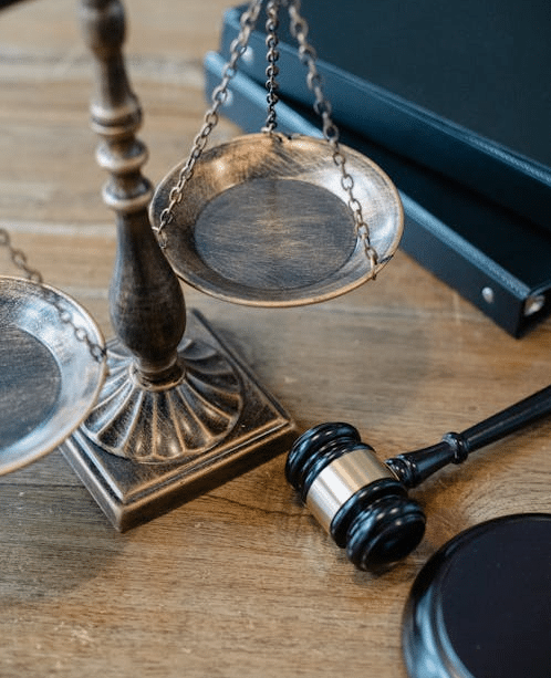 Scales of justice and gavel on a desk, symbolizing how NSW courts apply the high degree of confidence test in youth bail.