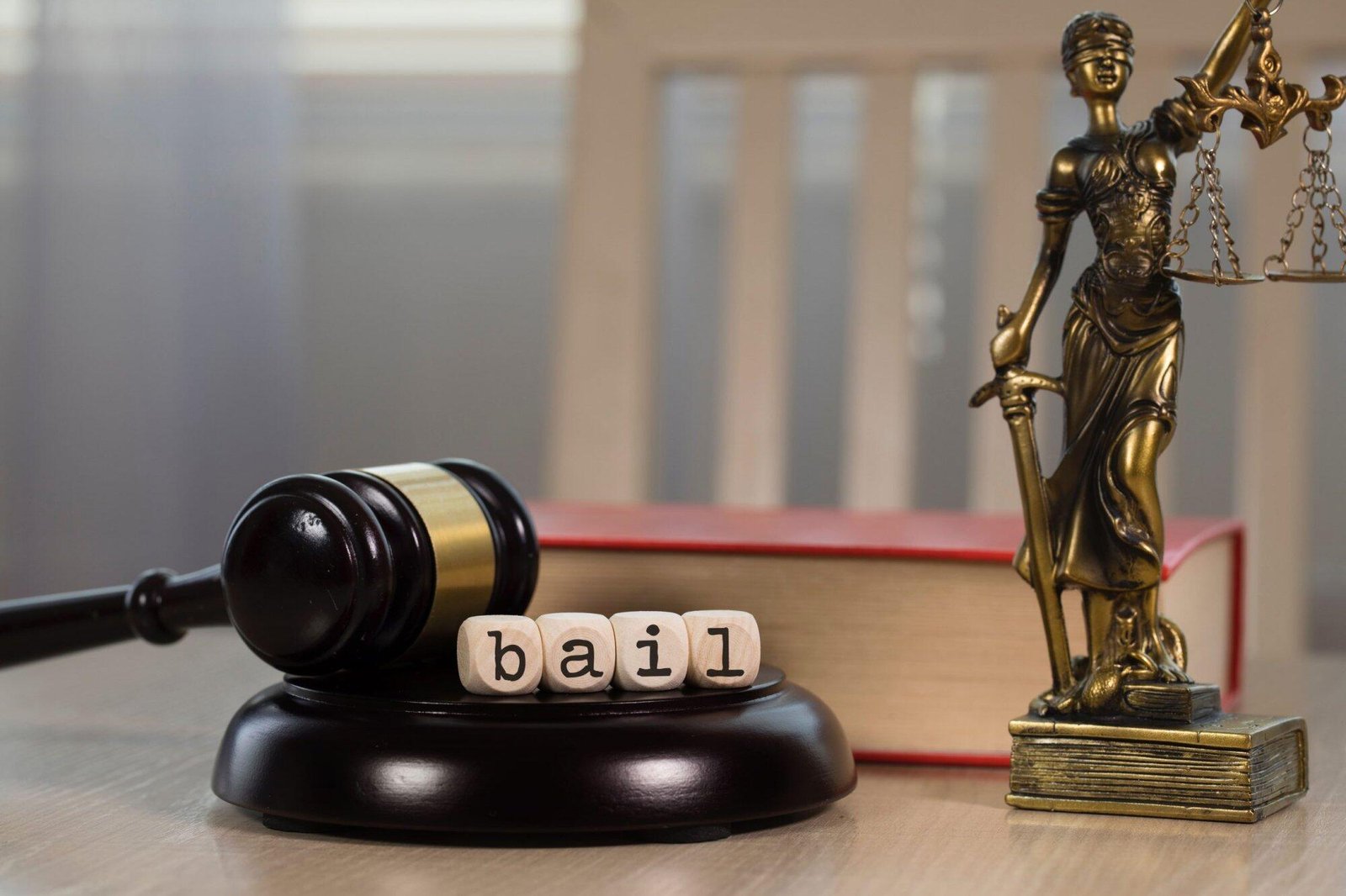 Gavel and scales with "bail" blocks on desk, symbolizing multiple bail applications in NSW and reapplication timing.