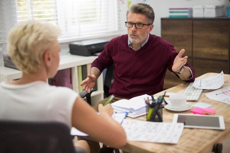Serious discussion between a lawyer and client about a NSW domestic violence case.